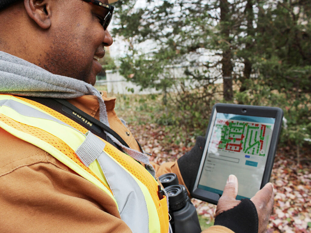 The Will Group engineering employee entering field data onto an iPad