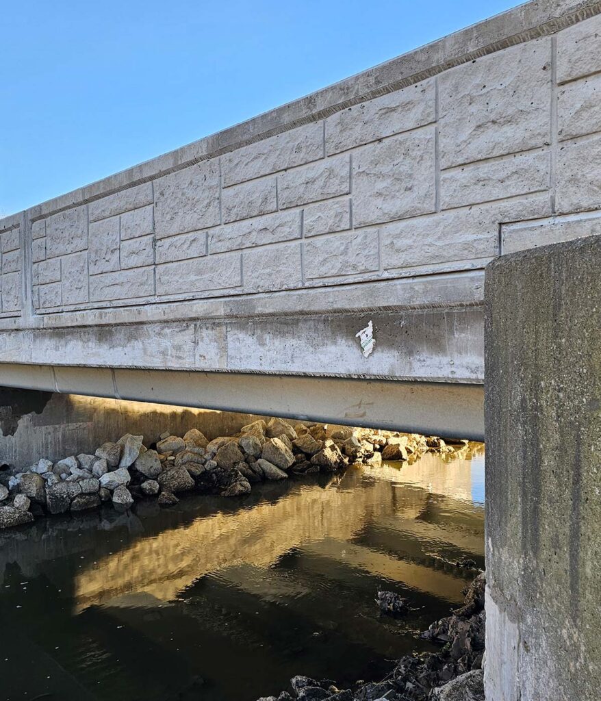 The side of a modern roadway bridge